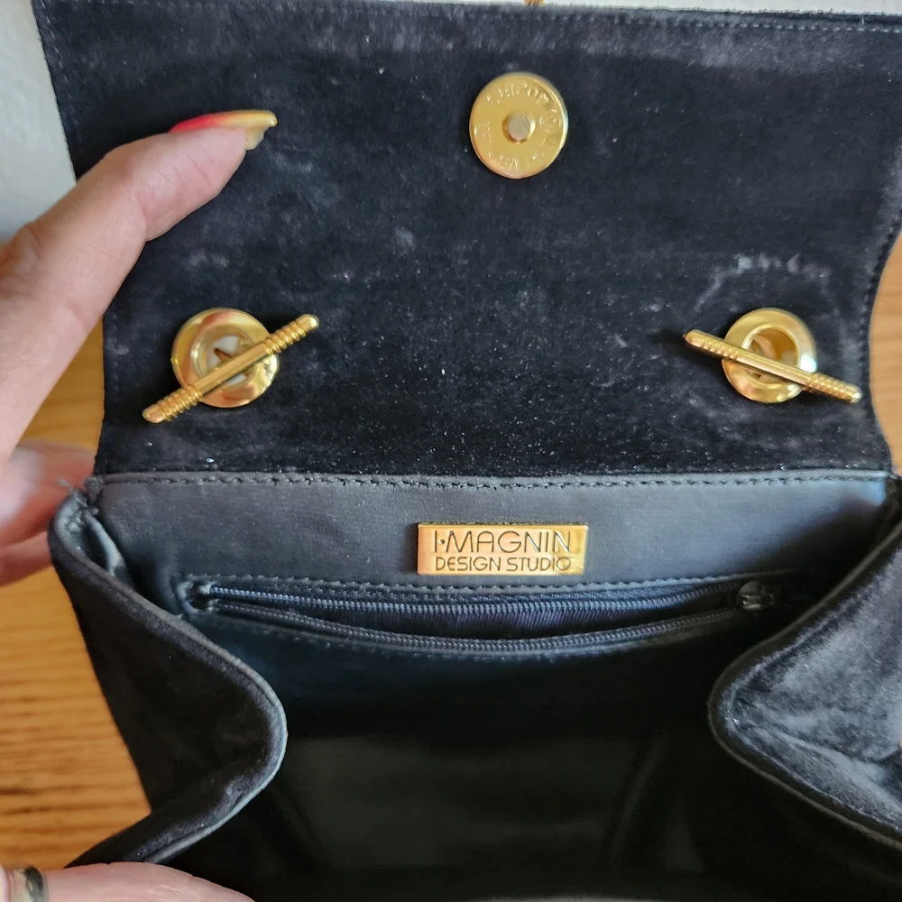 Elegant Black Shoulder Bag with Gold Accents
